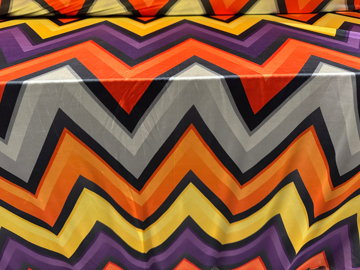 Soft touch stretch spandex single jersey fabric, per metre - jumbo chevron print - orange yellow & purple