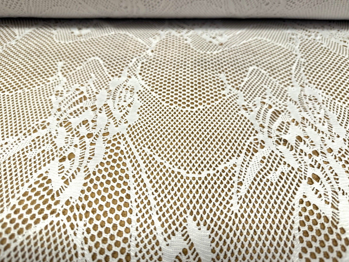 Stretch fishnet jersey fabric with floral design, per metre - white
