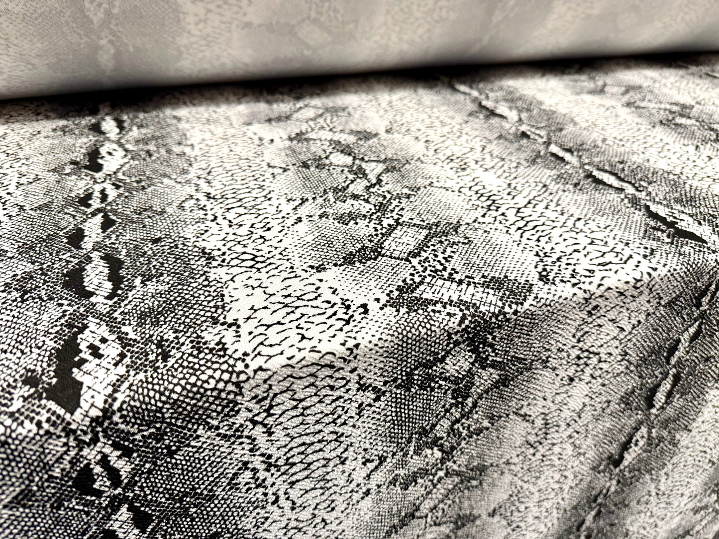 Waterfall textured scuba stretch double jersey fabric, per metre - snake skin print - black & ivory