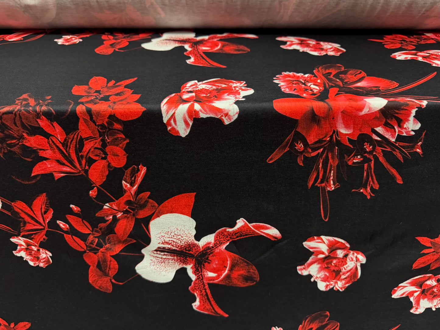 Soft handle jersey fabric, per metre - black with red orchid print