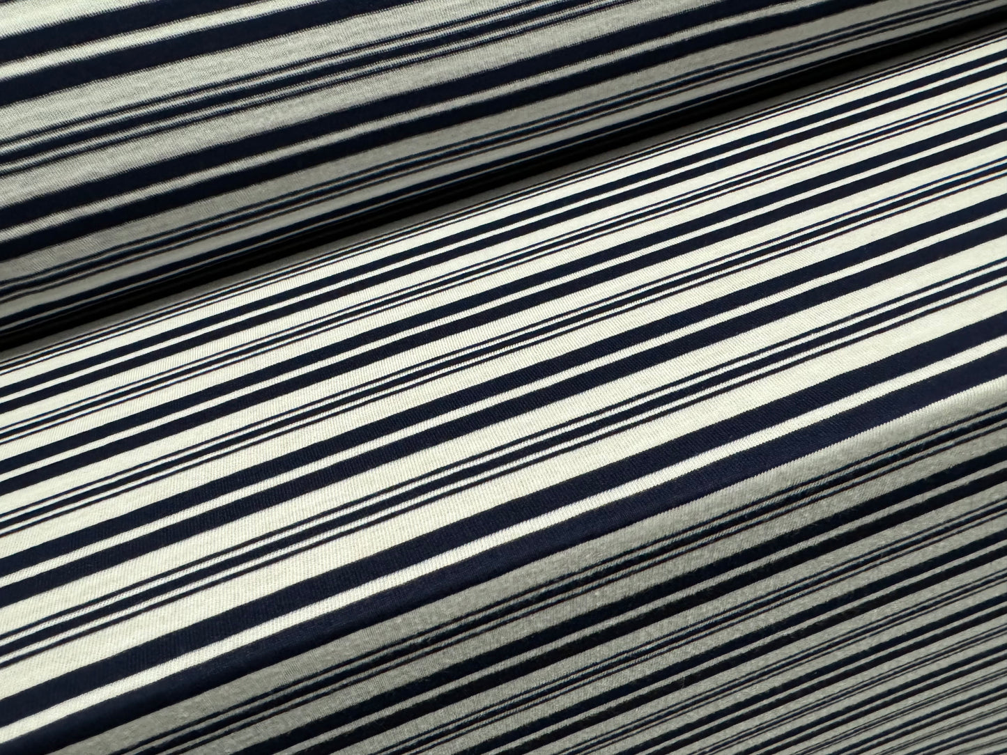 Viscose single jersey fabric, per metre - variated stripe - dark navy blue & white