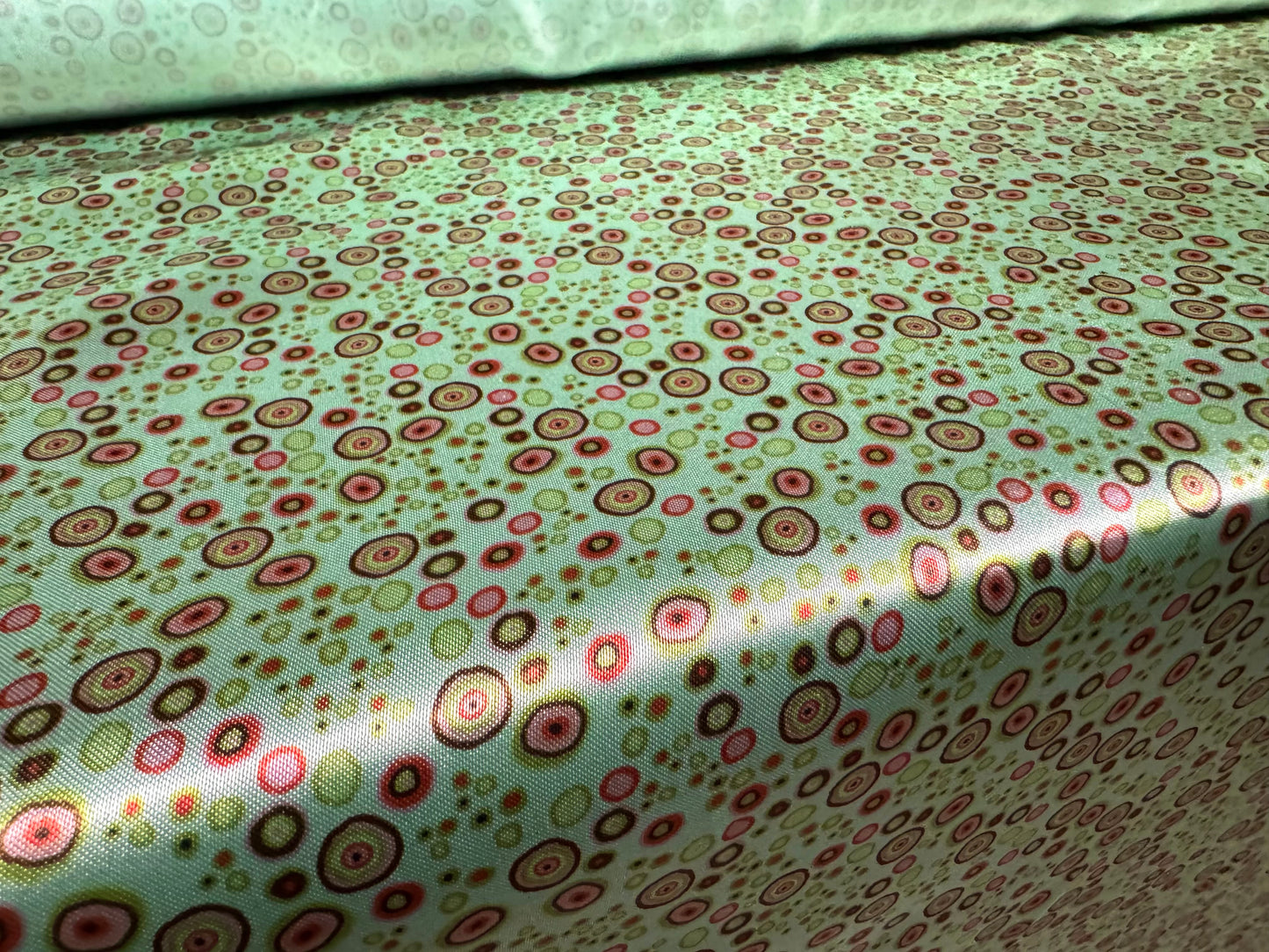 Silky satin woven dress fabric, per metre - circles print - aqua
