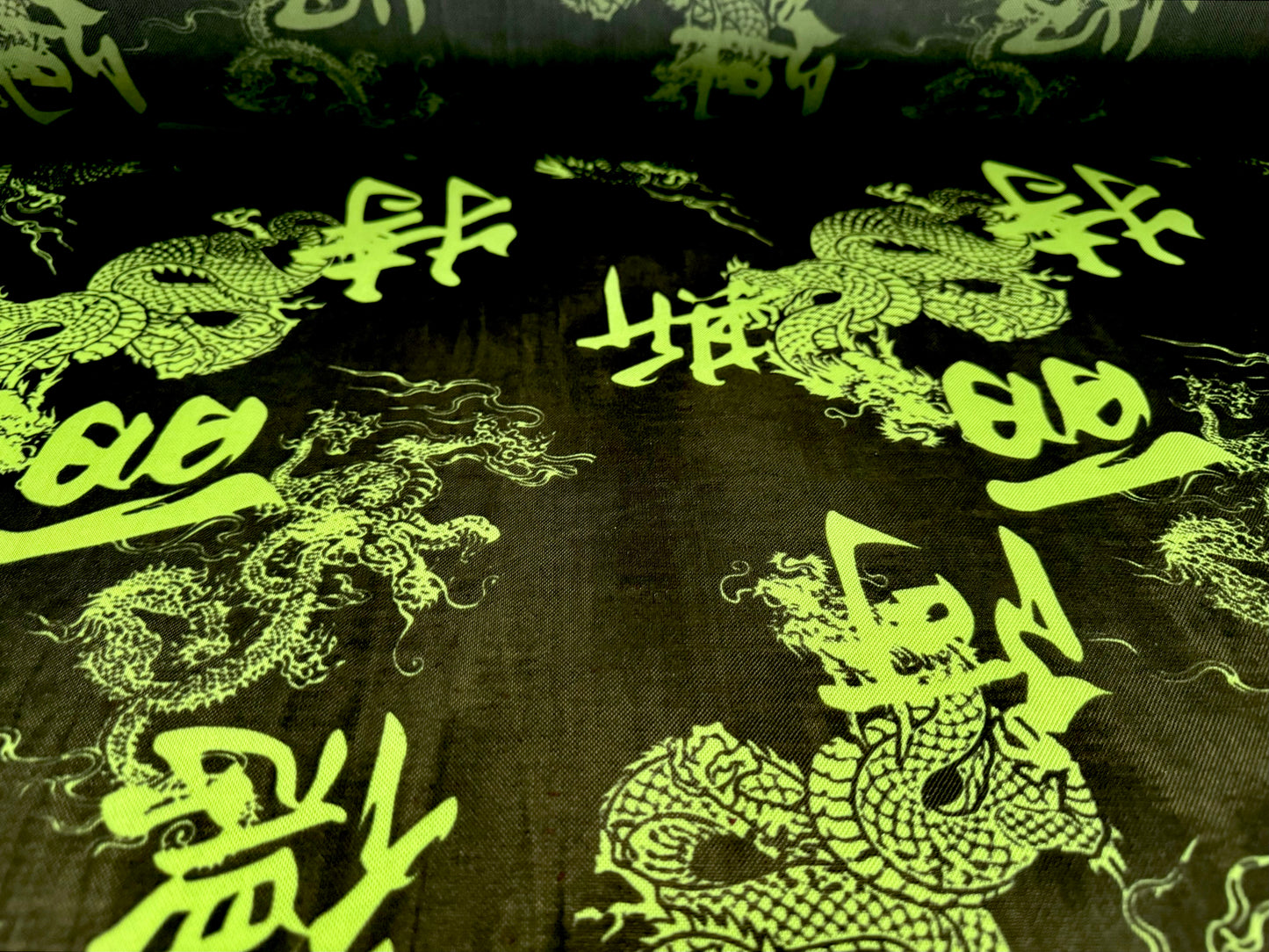 Power mesh net stretch spandex fabric, per metre - Year of the Dragon - black & green