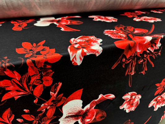 Soft handle jersey fabric, per metre - black with red orchid print