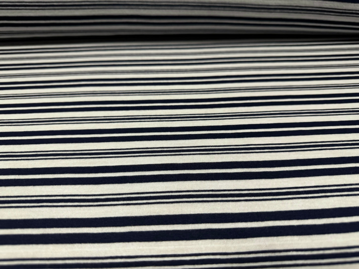 Viscose single jersey fabric, per metre - variated stripe - dark navy blue & white