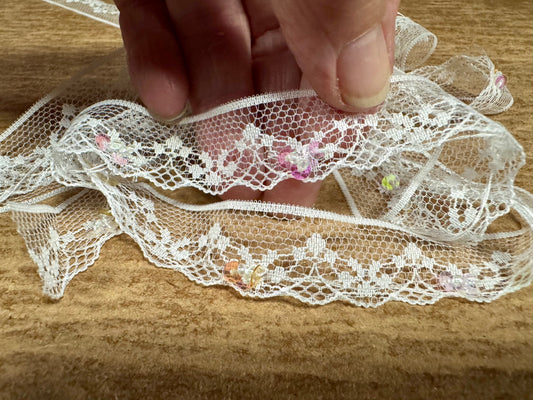 Scalloped lace edging trim fabric - floral - white with lilac sequins