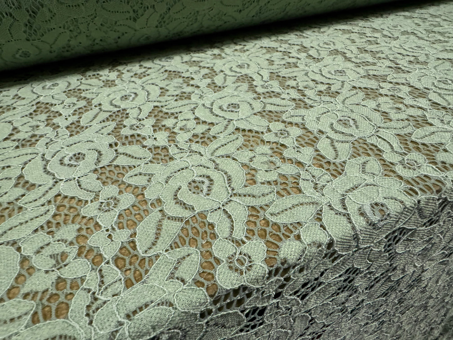 Corded stretch lace fabric, per metre - scalloped selvedge - floral - sage green