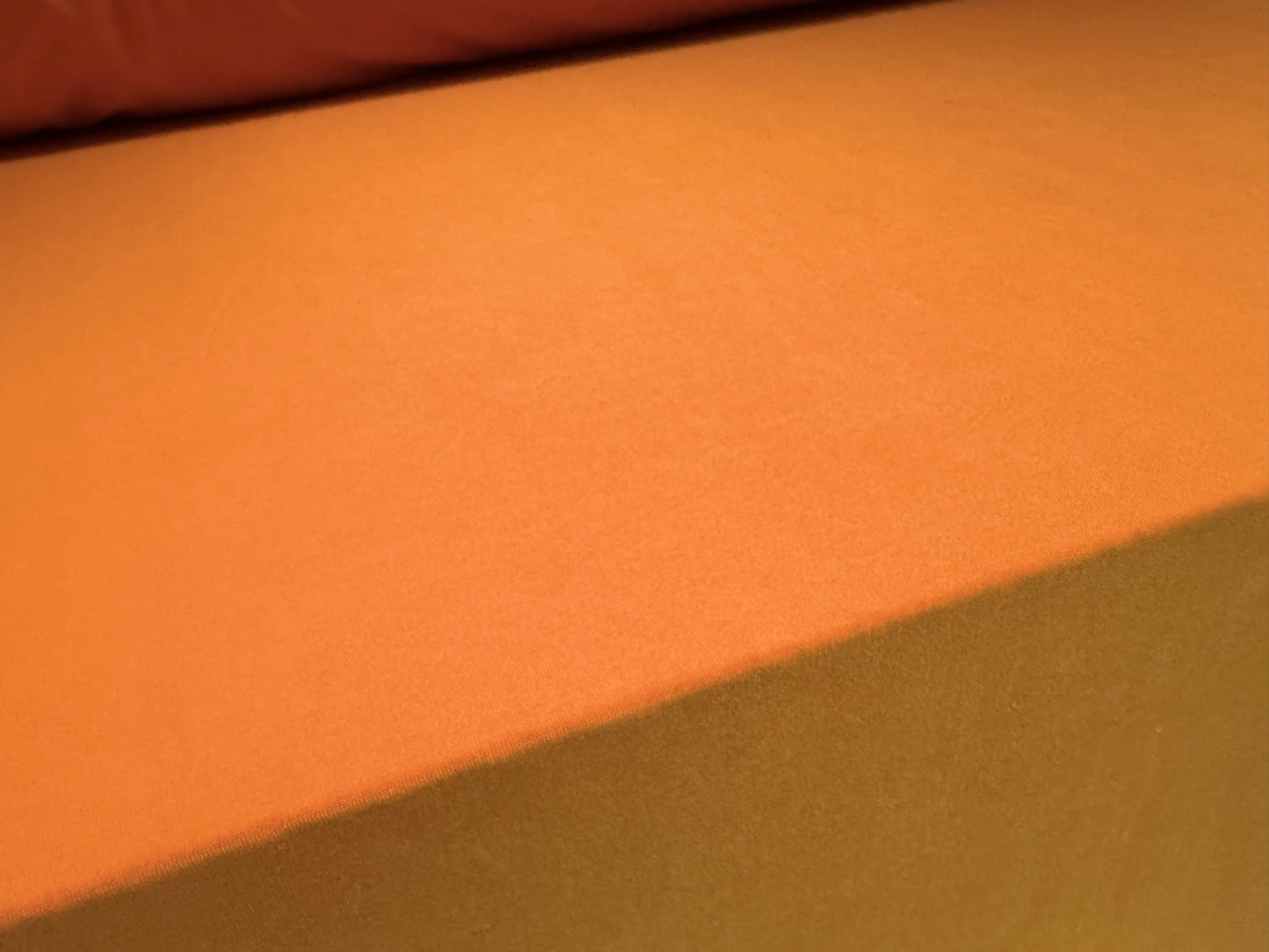 Soft touch spandex stretch jersey fabric, per metre - plain - pumpkin orange