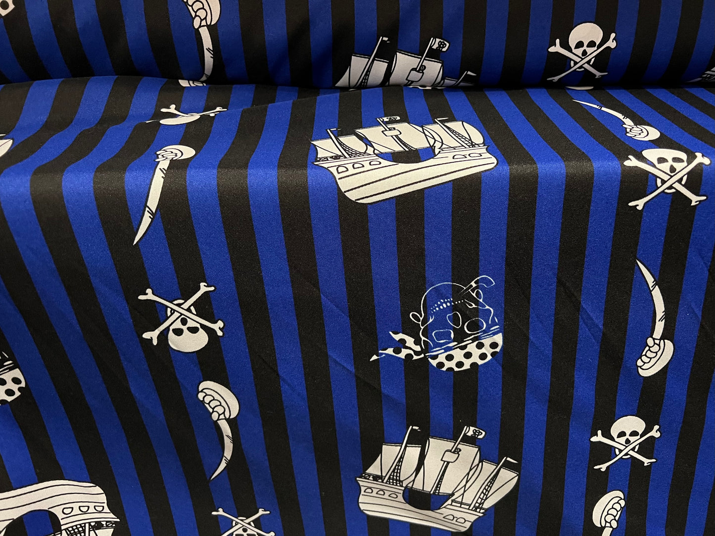 Panama woven fashion fabric, per metre - Jolly Roger pirate ship print - blue stripe