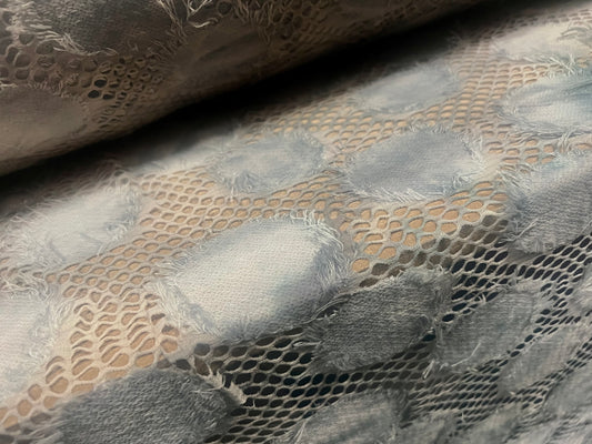 Couture fishnet lace dress fabric with frayed appliqué, per metre - grey