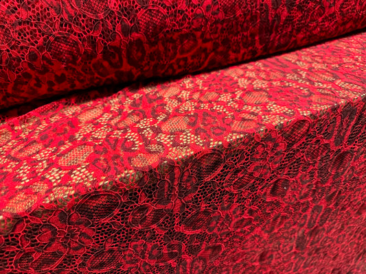 Stretch lace dress fabric with scalloped selvedge, per metre - distressed animal print - red & maroon