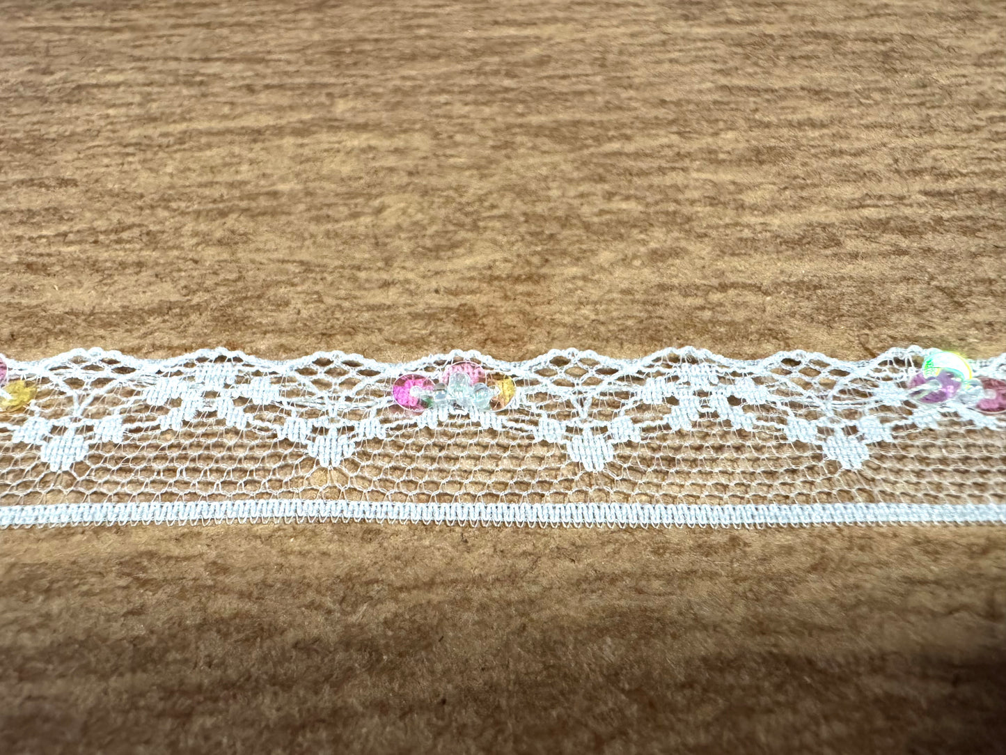 Scalloped lace edging trim fabric - floral - white with lilac sequins