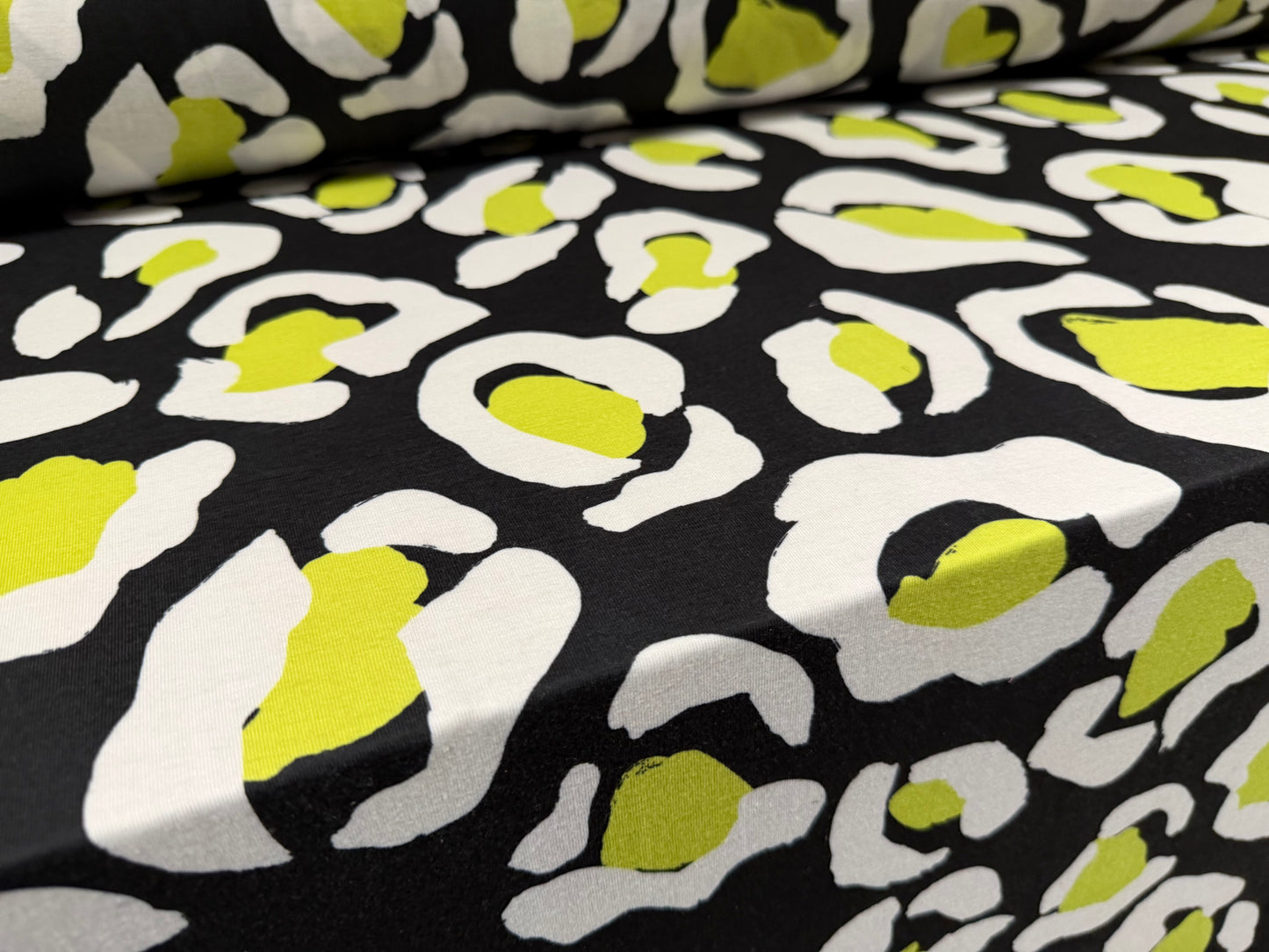 Soft handle stretch single jersey fashion fabric, per metre - animal print - black & lime