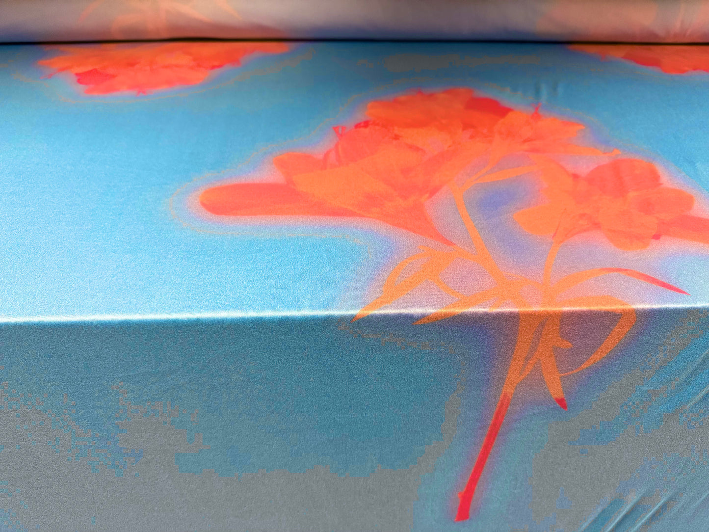 Soft touch stretch spandex single jersey fabric, per metre - stylised flower print - sky blue & orange