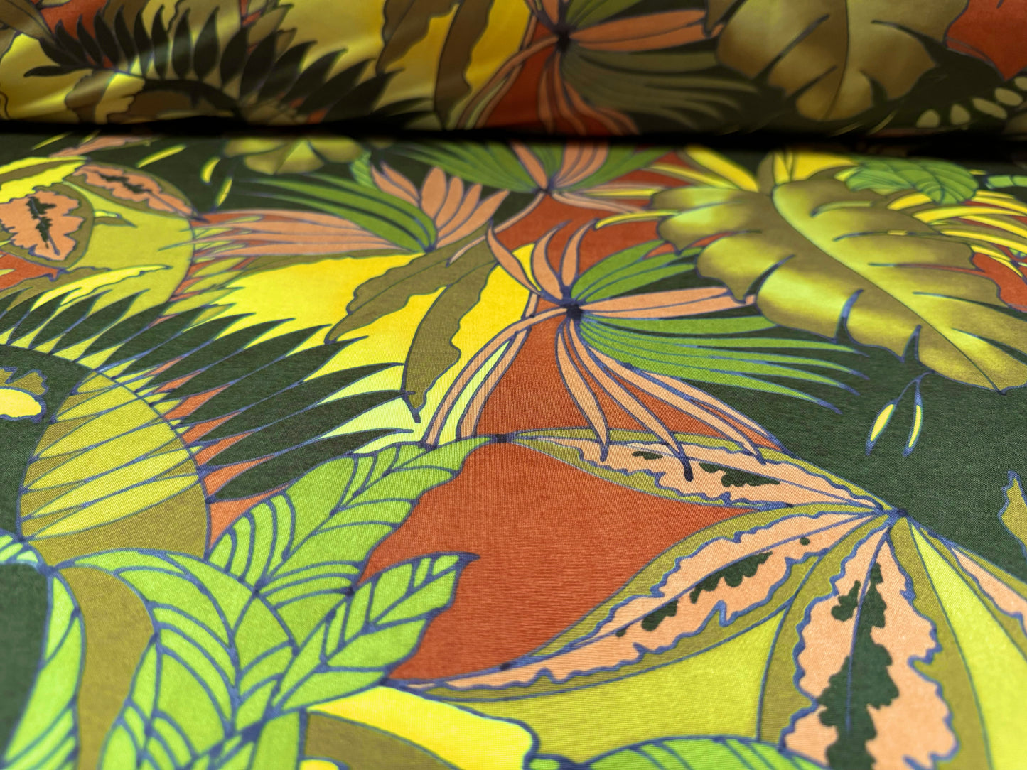 Soft touch stretch spandex single jersey fabric, per metre - jungle leaves print - green & rust