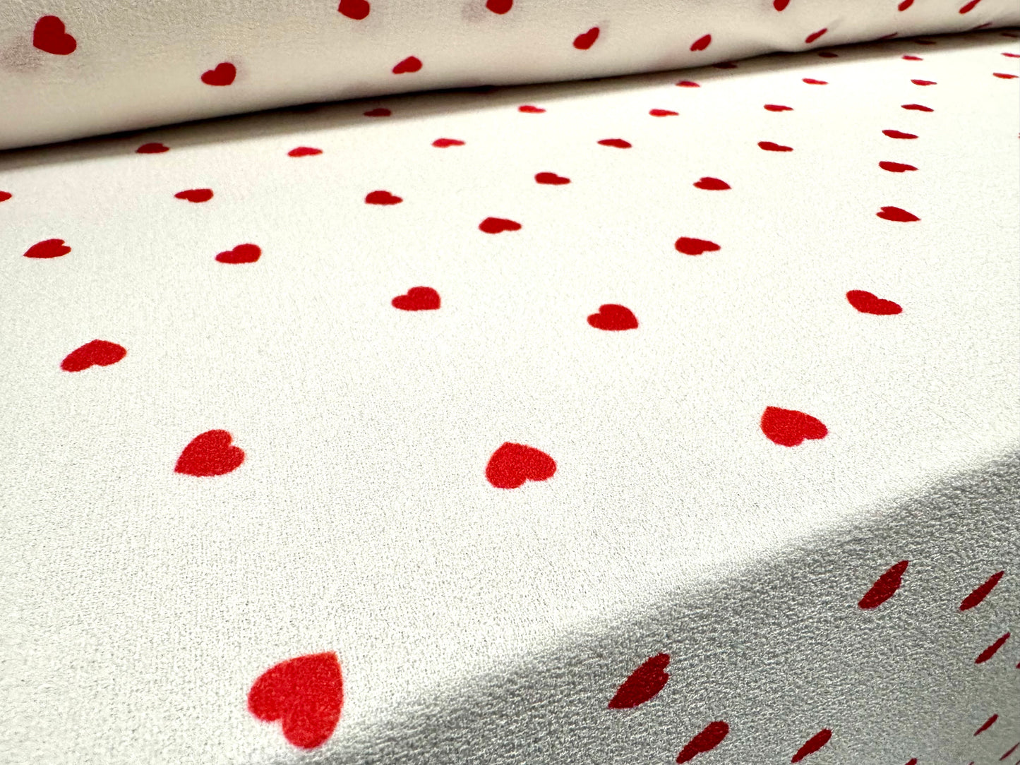 Bubble crepe woven dress fabric with comfort stretch, per metre - love heart print - ivory & red