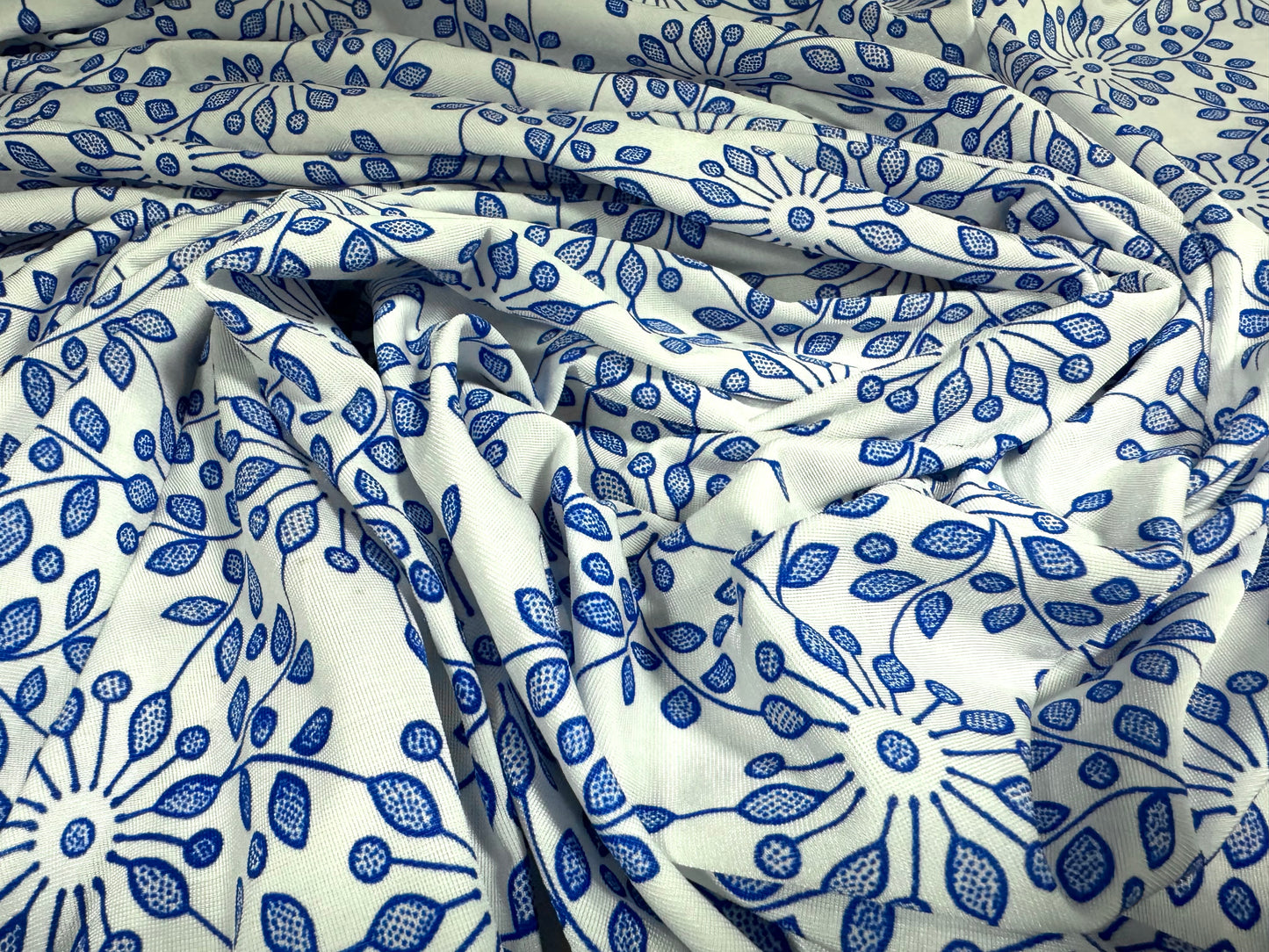 Finely textured stretch spandex single jersey fabric, per metre - stylised flower print - cobalt blue & white