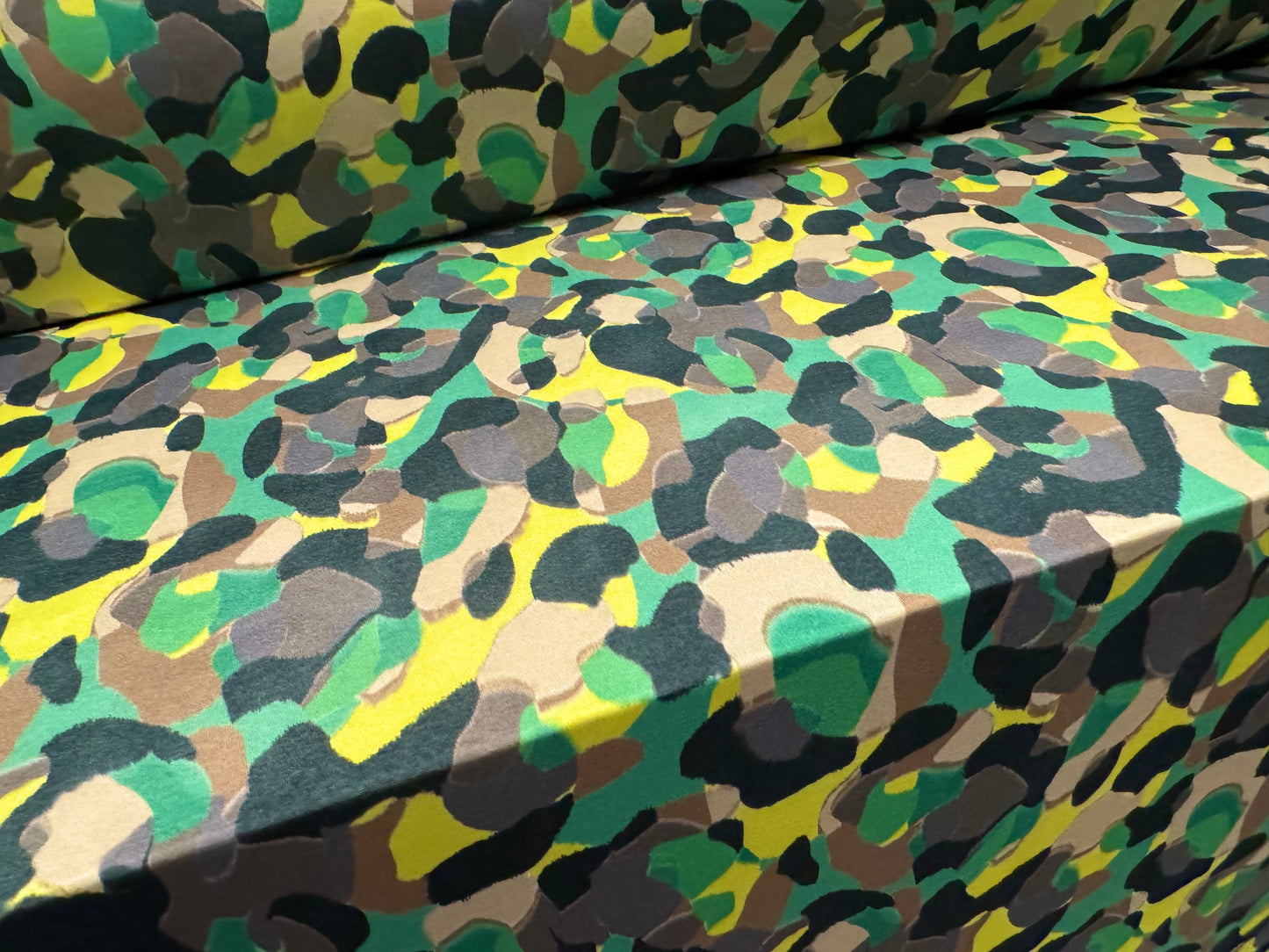 Soft touch stretch spandex single jersey fabric, per metre - stylised animal print - green & yellow