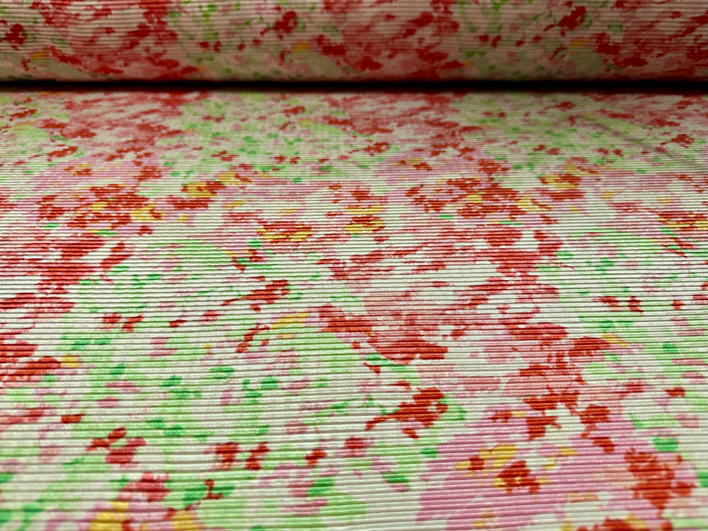 Stretch plissé pleated satin dress fabric, per metre - stylised floral print - pink red & green