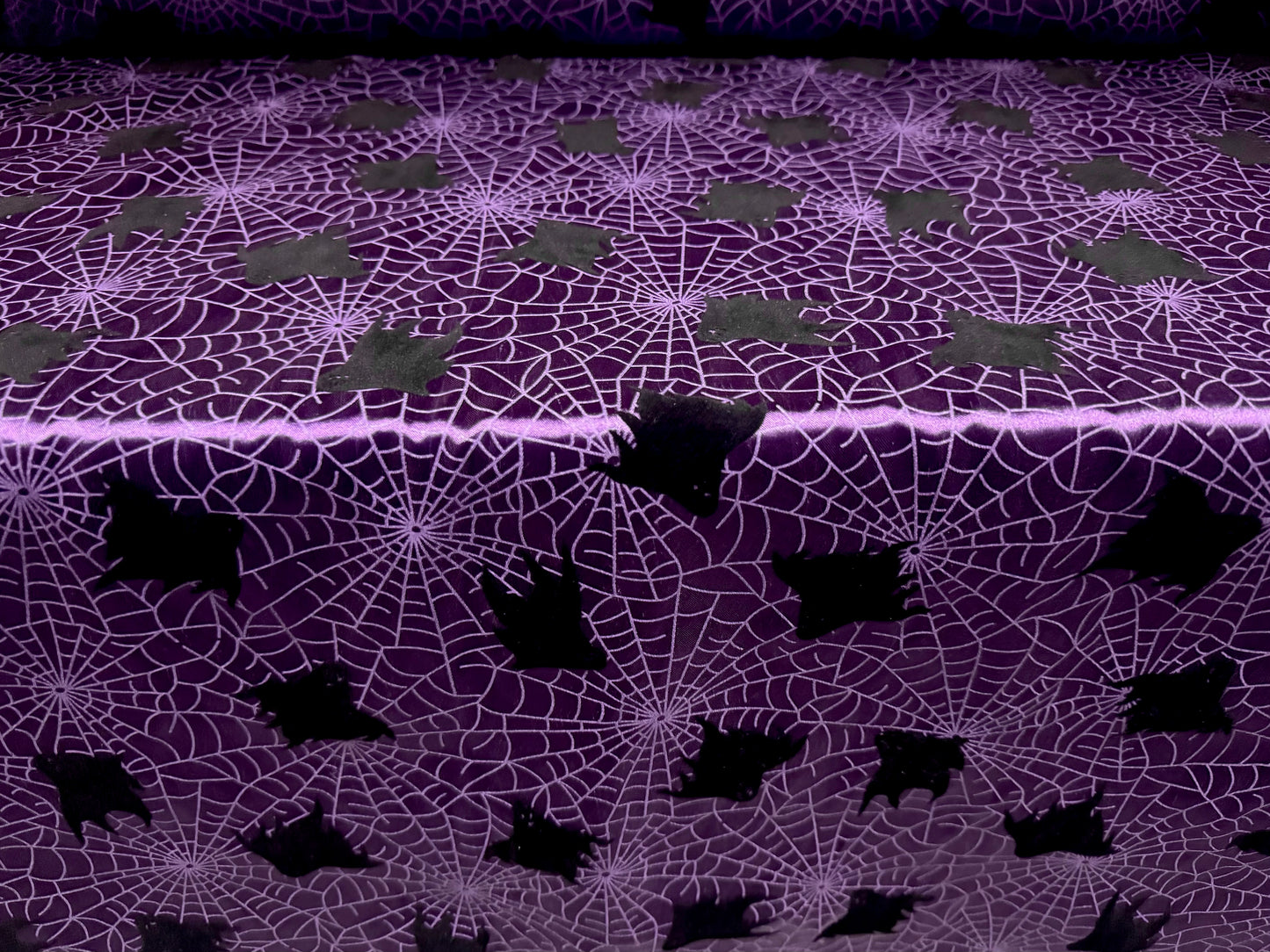 Satin woven dress fabric, per metre - flocked bats & cobwebs Halloween print - purple & black