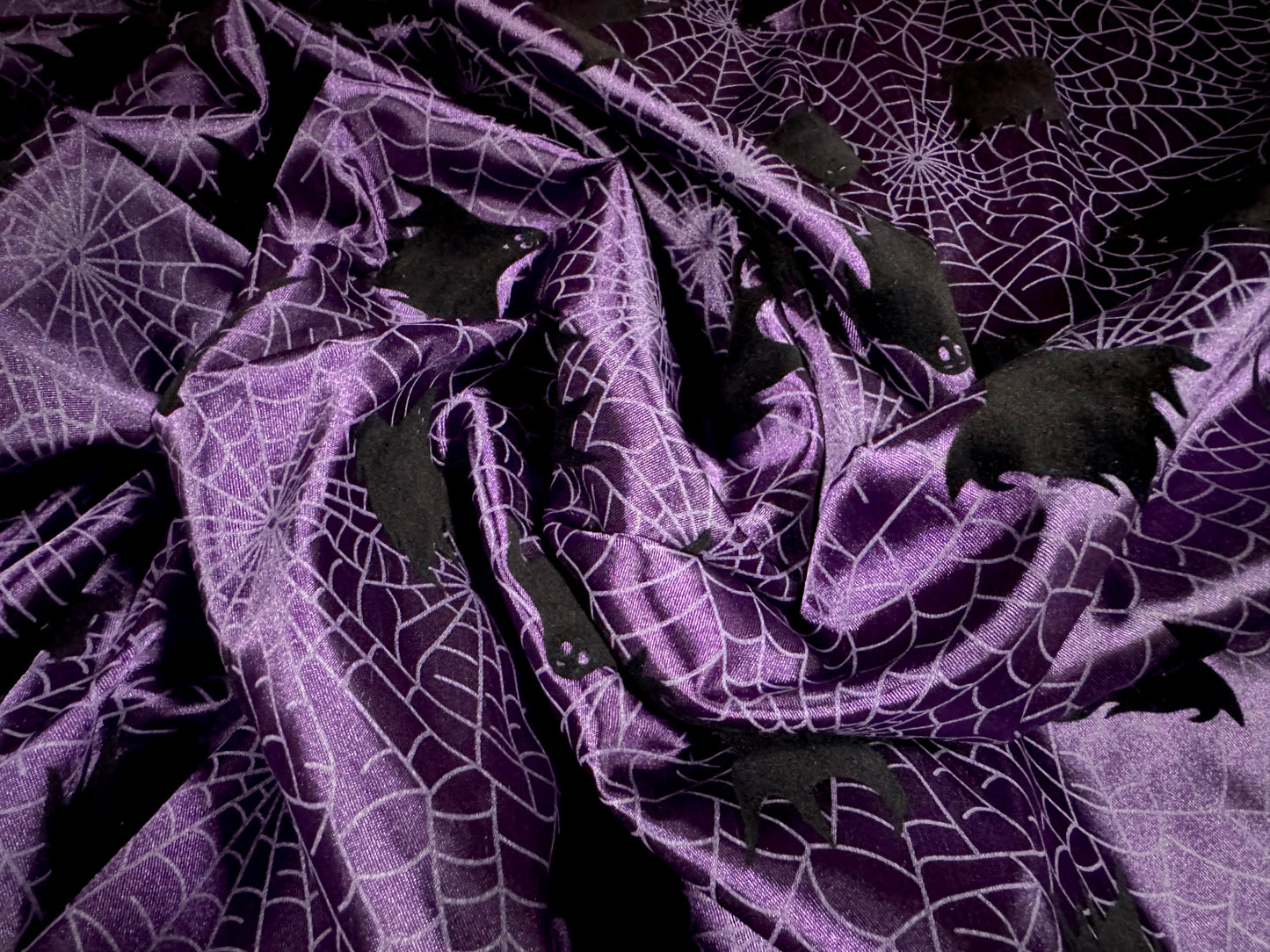 Satin woven dress fabric, per metre - flocked bats & cobwebs Halloween print - purple & black