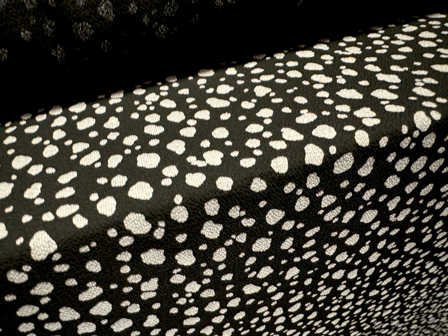 Pebble crepe woven dress fabric, per mere - Dalmatian animal print - black & putty