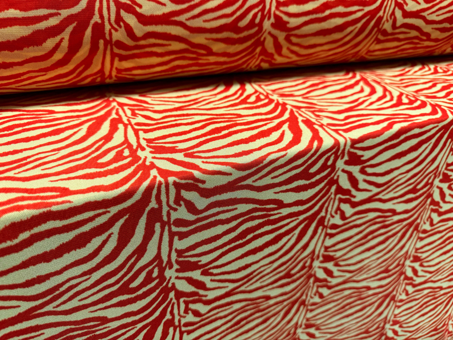 Power mesh crepe stretch spandex fabric, per metre - zebra animal print - red & cream