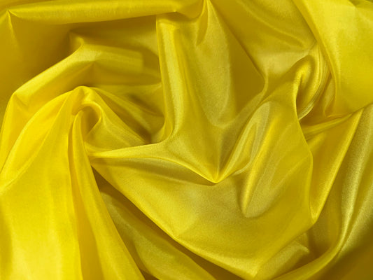 Woven polyester satin lining fabric, per metre - plain - yellow