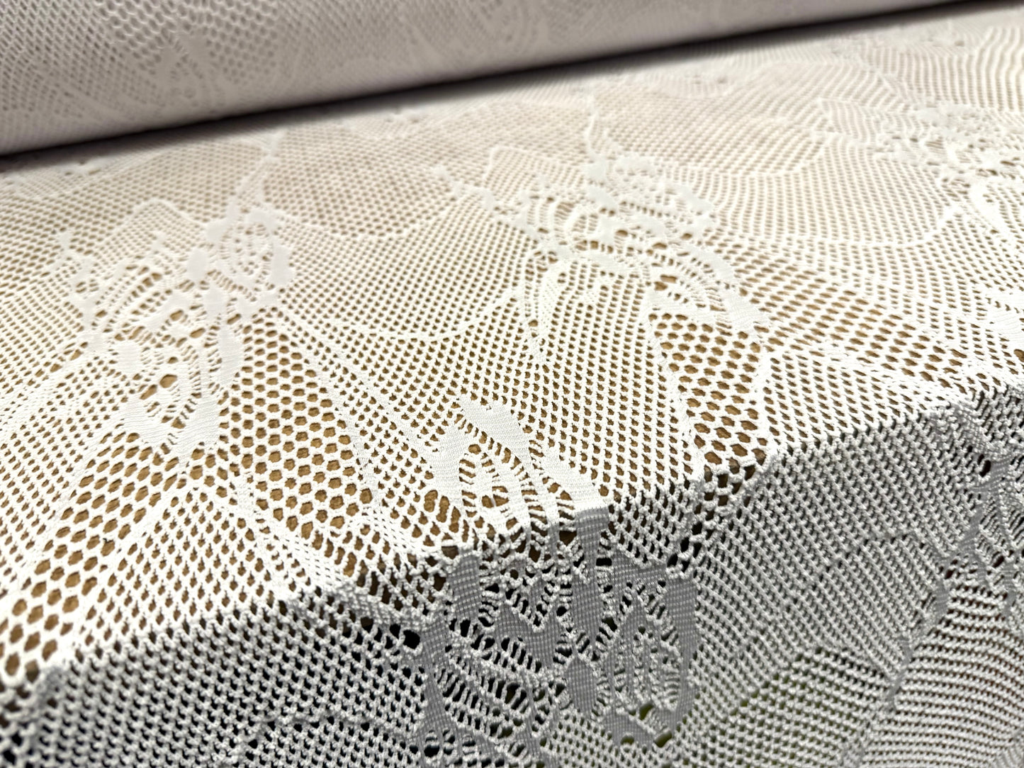 Stretch fishnet jersey fabric with floral design, per metre - white