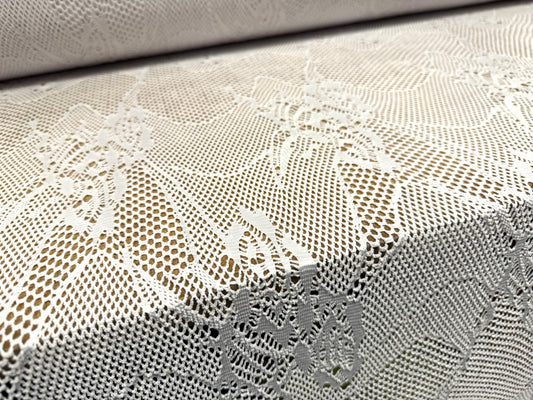 Stretch fishnet jersey fabric with floral design, per metre - white