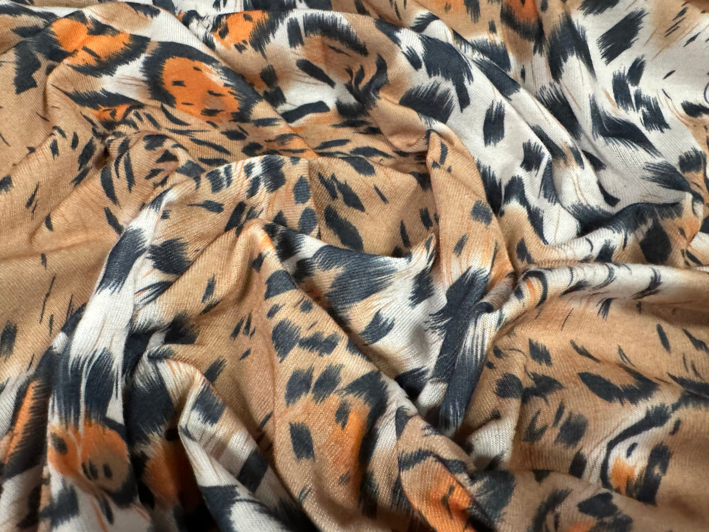 Soft handle stretch single jersey fashion fabric, per metre - stylised animal print - beige & orange