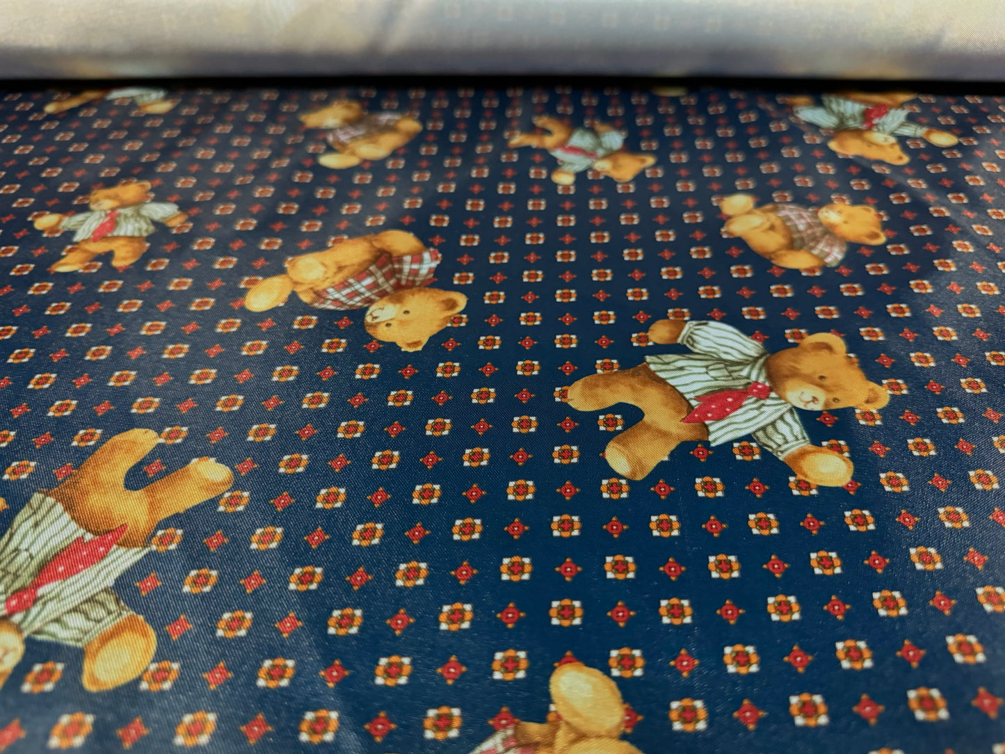 Silky satin woven dress fabric, per metre - teddy bear print - navy blue & brown