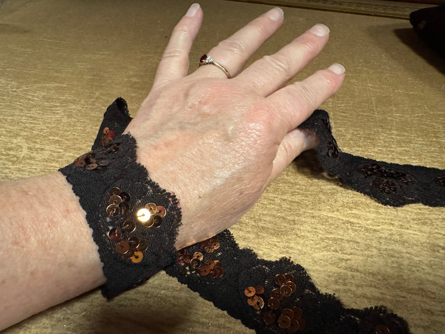 Scalloped lace edging trim fabric with sequins - stretch - dark brown & copper