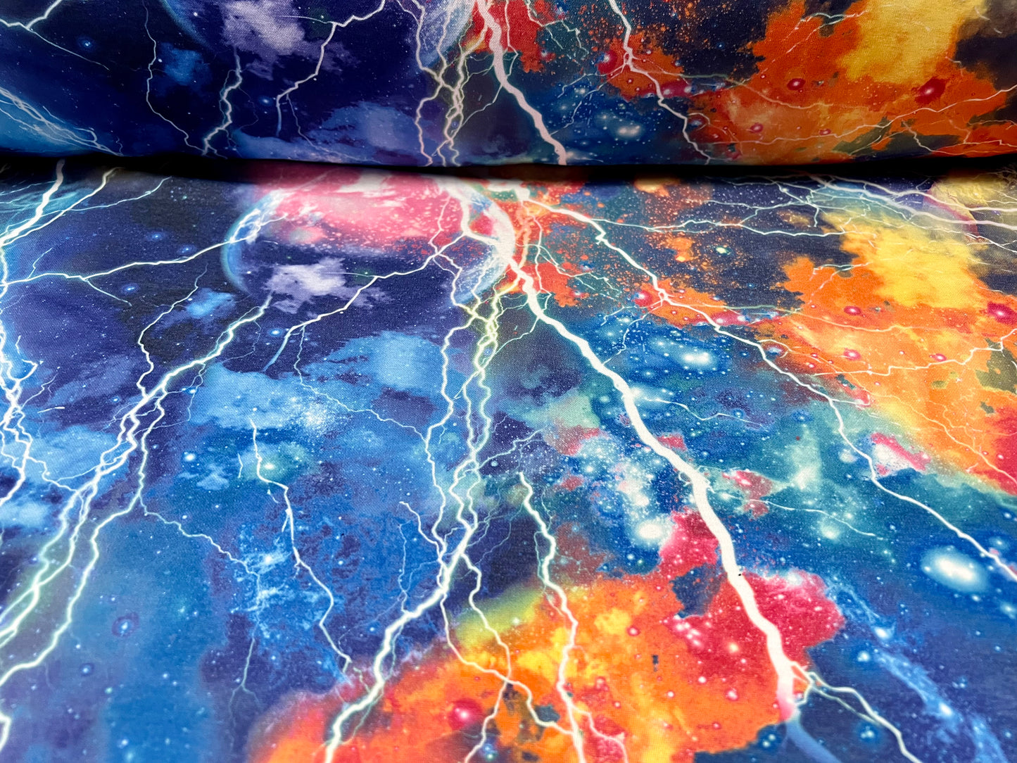 Stretch spandex interlock jersey fabric, per metre - cosmic lightning print - multicolour