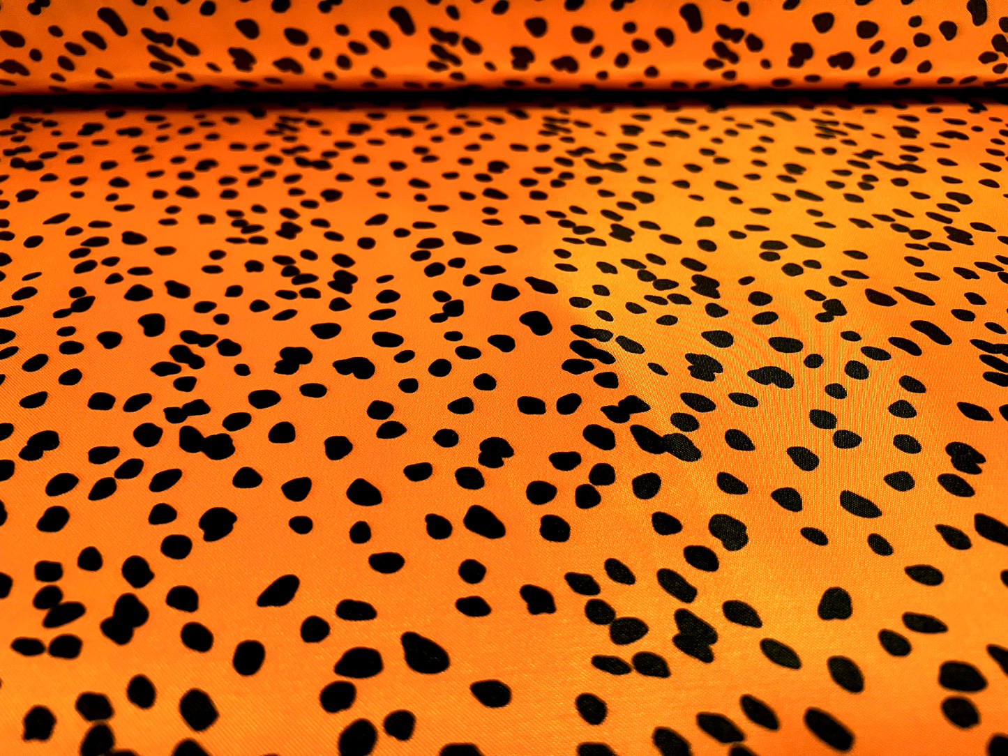 Silky Satin woven dress fabric, per metre - Dalmatian animal print - orange & black