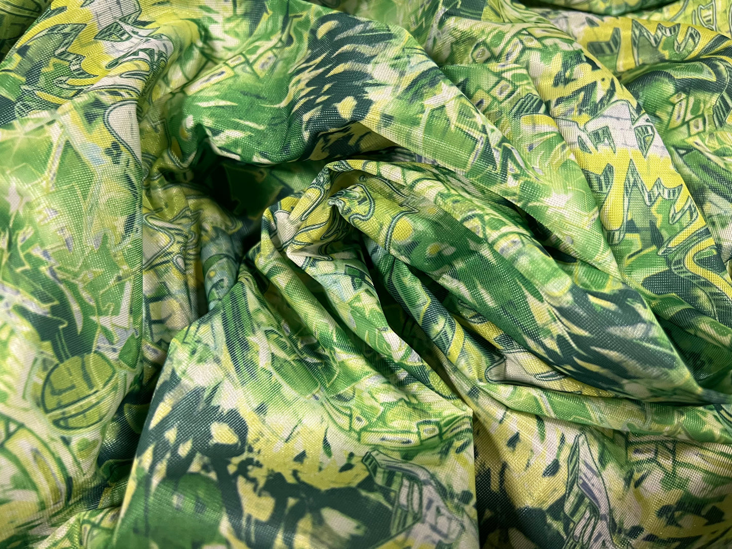 Sateen single jersey fabric, per metre - graffiti print - green