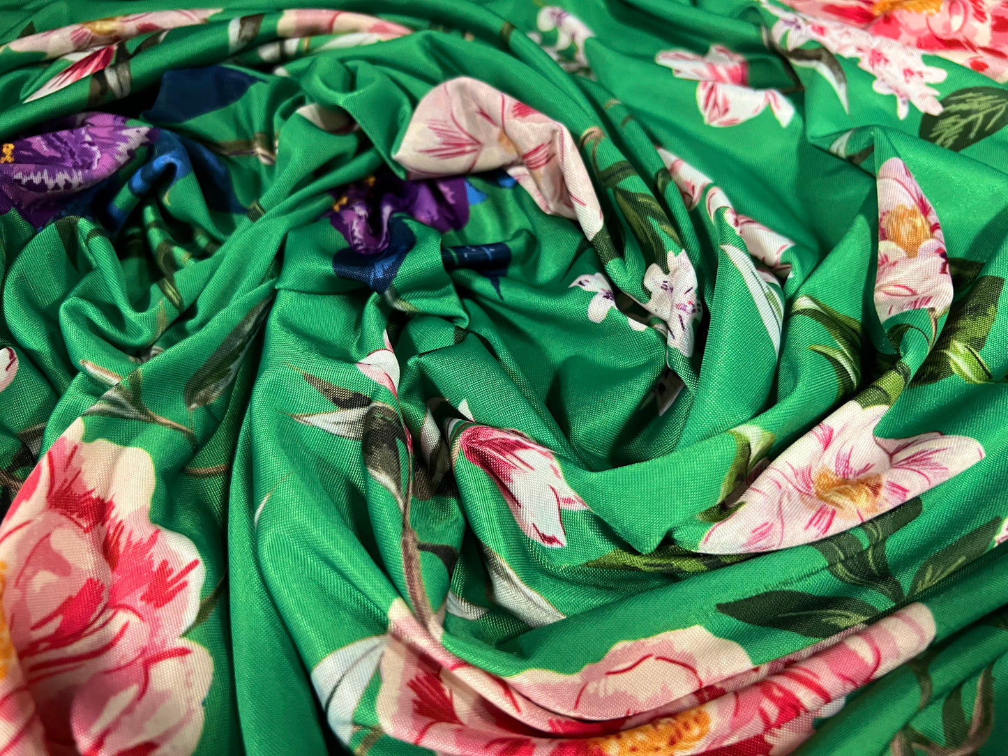 Soft touch stretch spandex jersey fabric, per metre - green with multicoloured flowers print