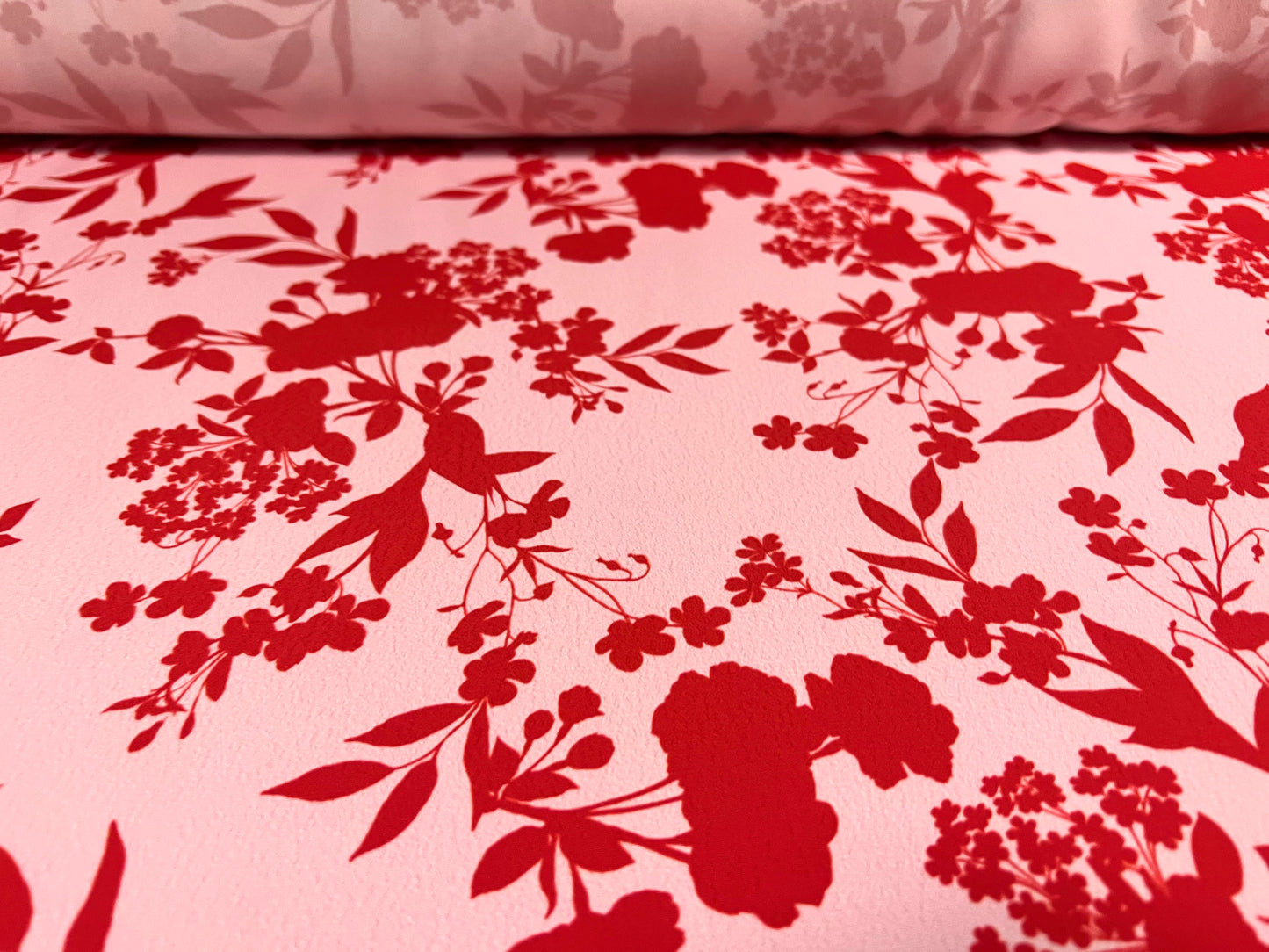 Woven crepe dress fabric, per metre - floral silhouette print - red & pink