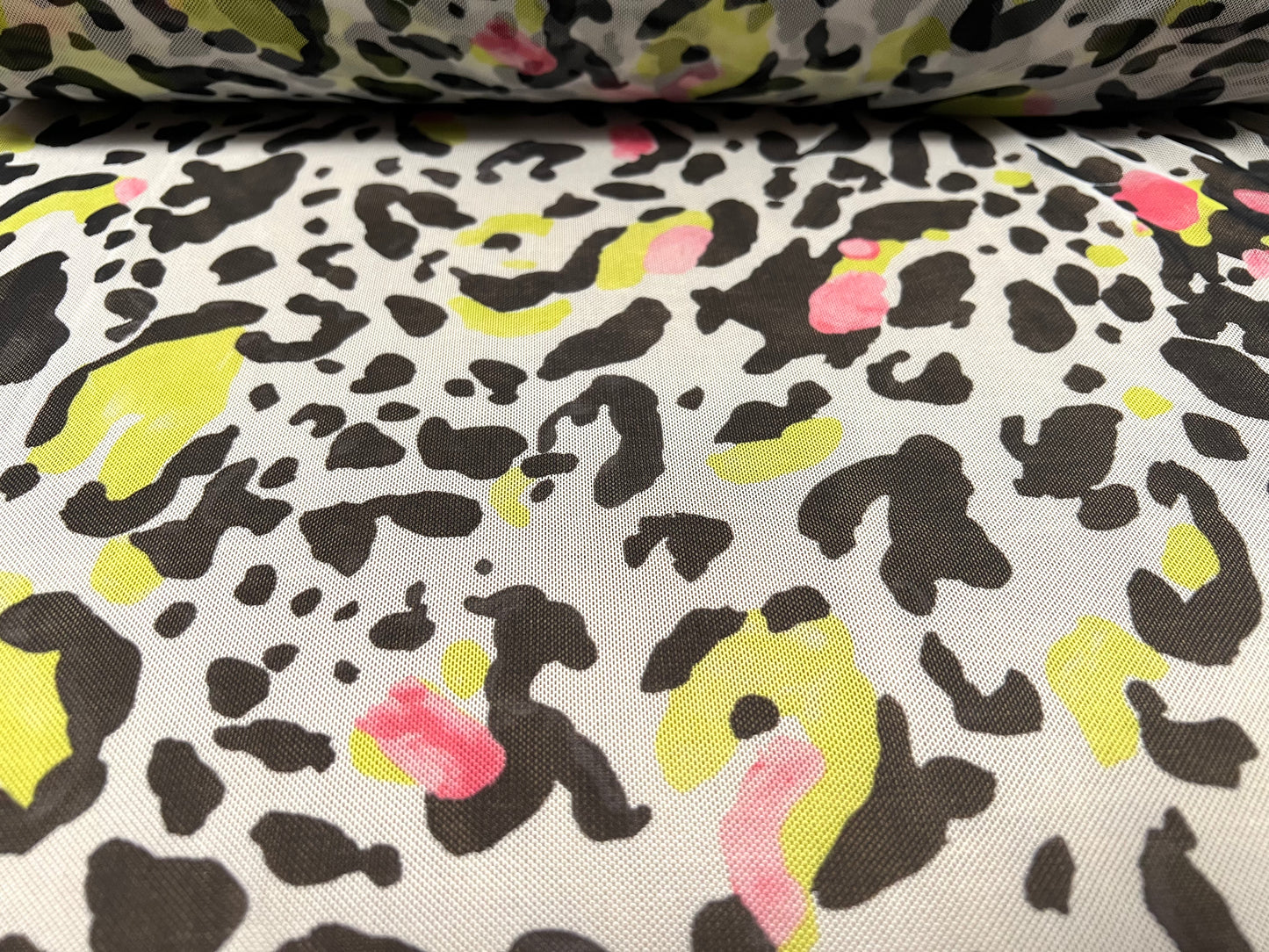Power mesh net sheer stretch spandex fabric, per metre - stylised cheetah print - white black pink & lime