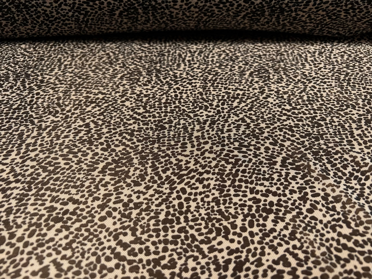 Power mesh net sheer stretch spandex fabric, per metre - small animal print - stone & black