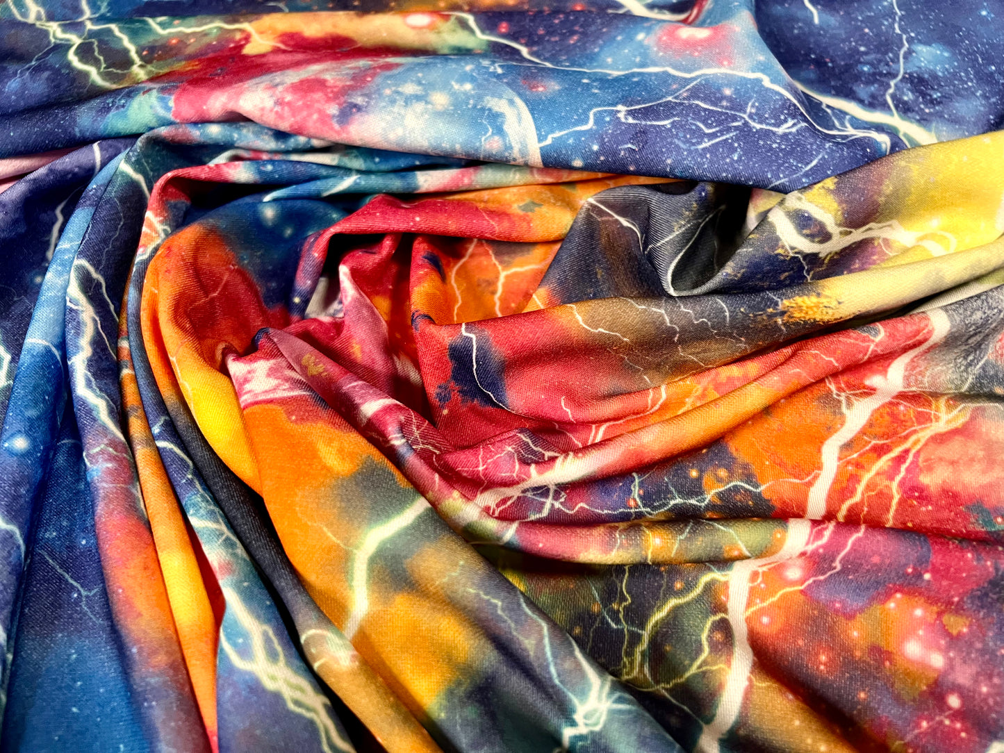 Stretch spandex interlock jersey fabric, per metre - cosmic lightning print - multicolour