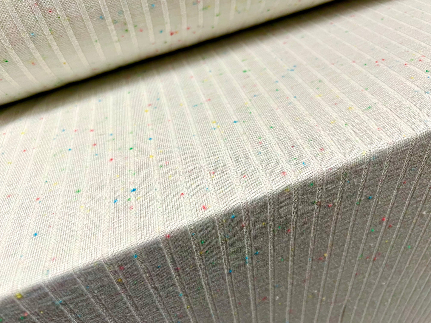 Stretch spandex rib jersey fabric, per metre - ivory with tutti frutti slub