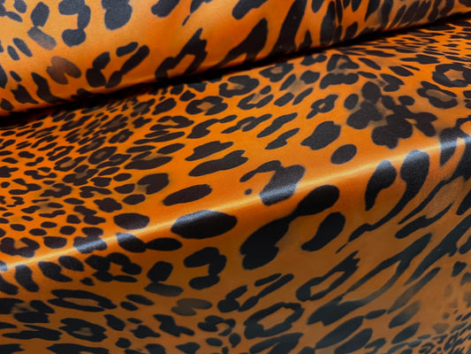 Silky Satin woven dress fabric, per metre - distressed leopardskin animal print - orange