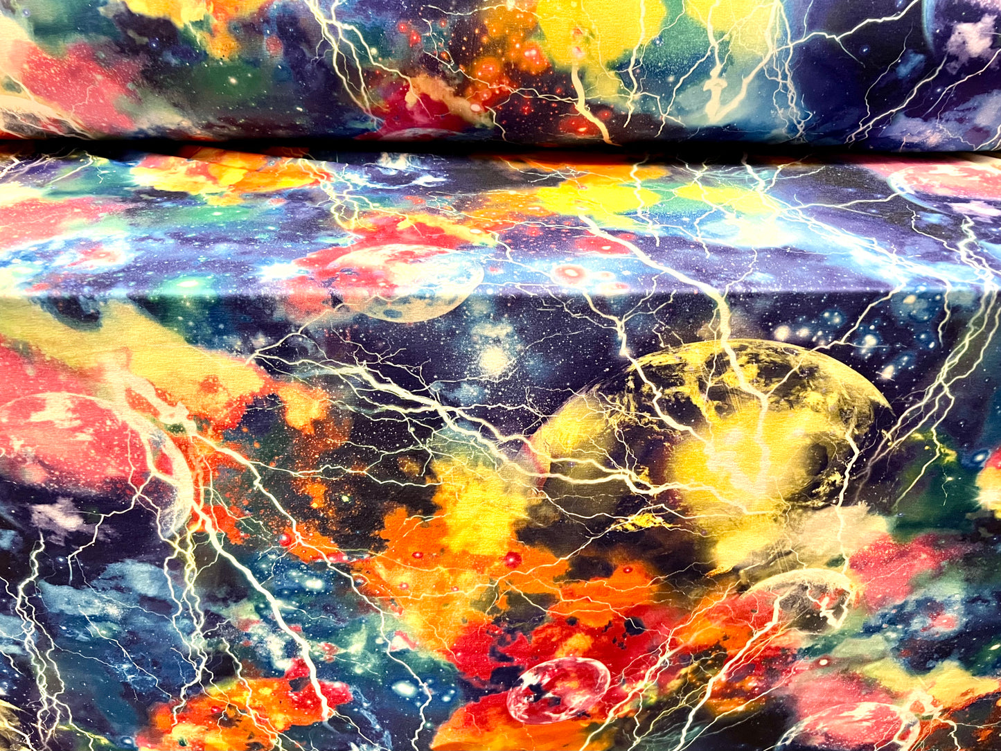 Stretch spandex interlock jersey fabric, per metre - cosmic lightning print - multicolour