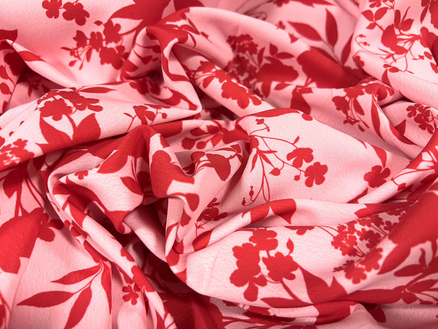 Woven crepe dress fabric, per metre - floral silhouette print - red & pink