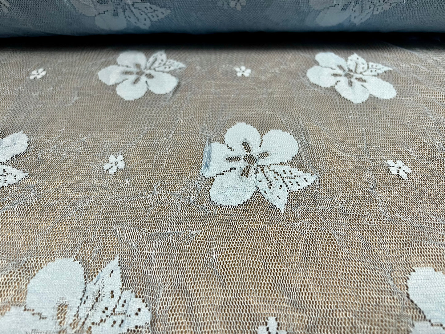 Sheer mesh lace fabric with scalloped selvedge, per metre - large flower design - pale blue