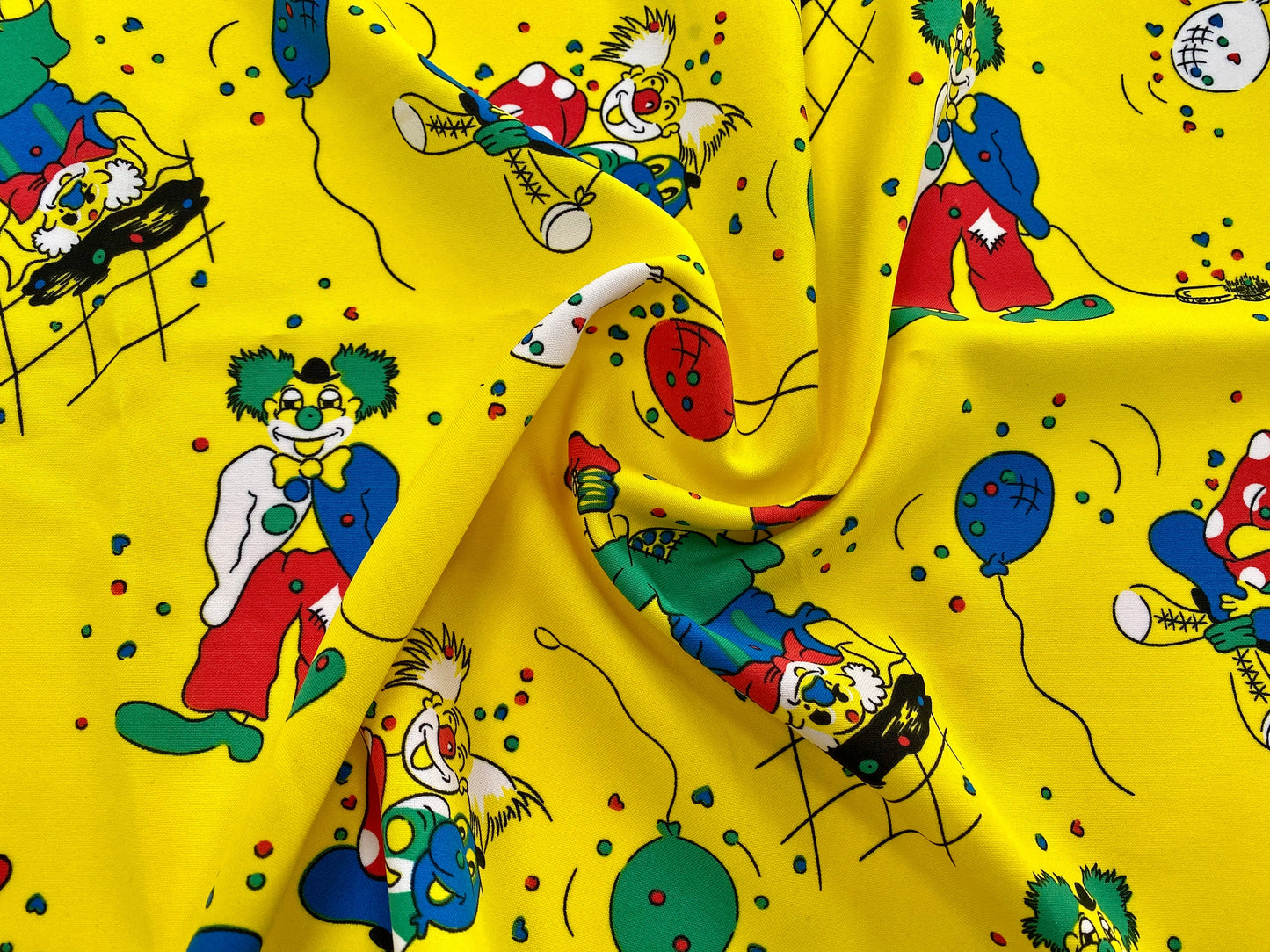 Circus clowns yellow party print woven dress fabric, per metre