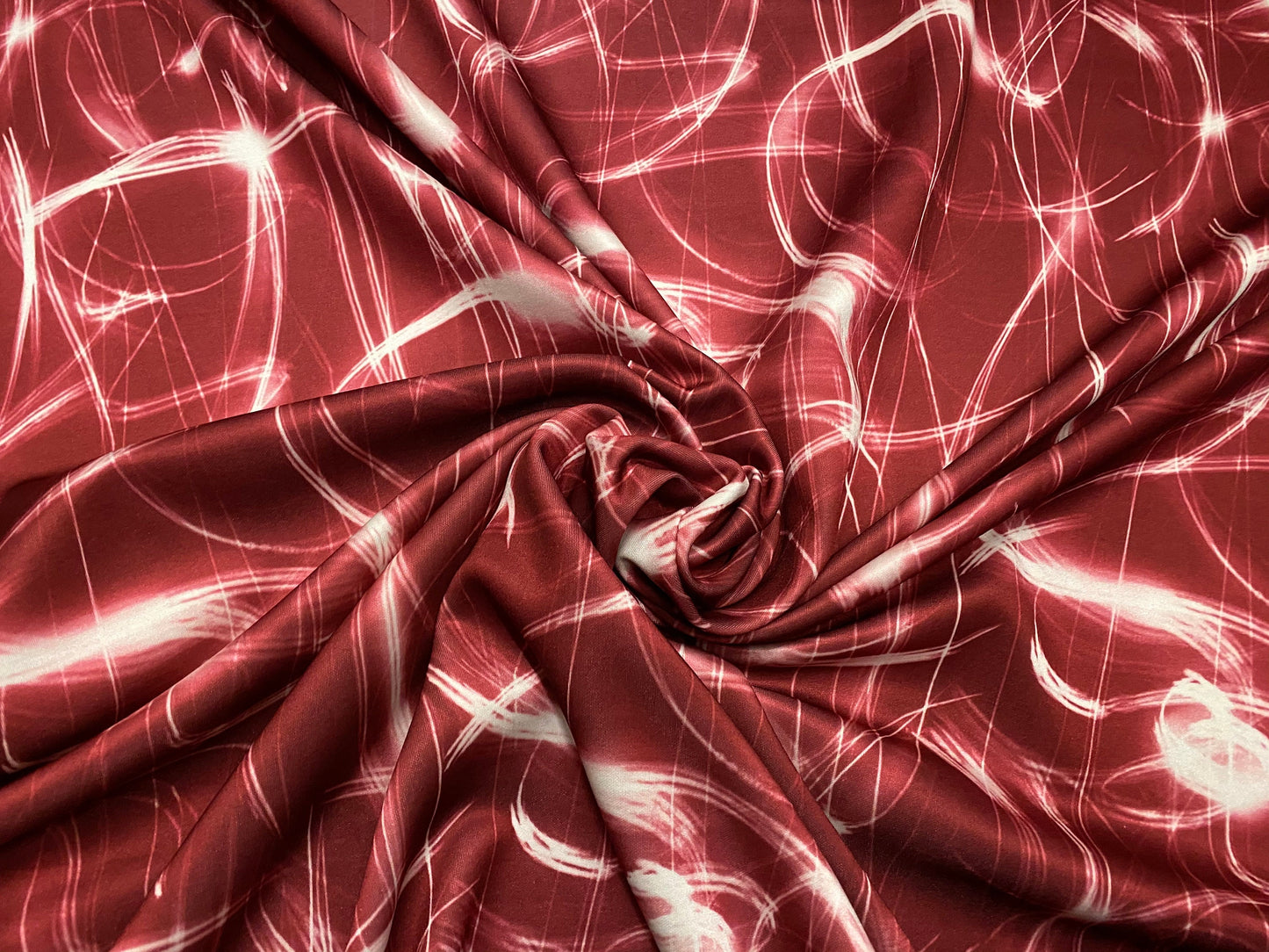 Scuba neoprene style spandex stretch double jersey fabric, per metre - solar flares print - red