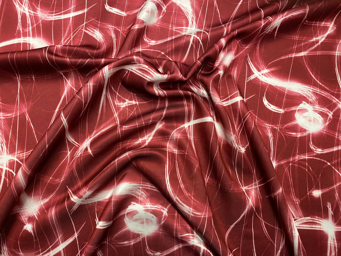 Scuba neoprene style spandex stretch double jersey fabric, per metre - solar flares print - red