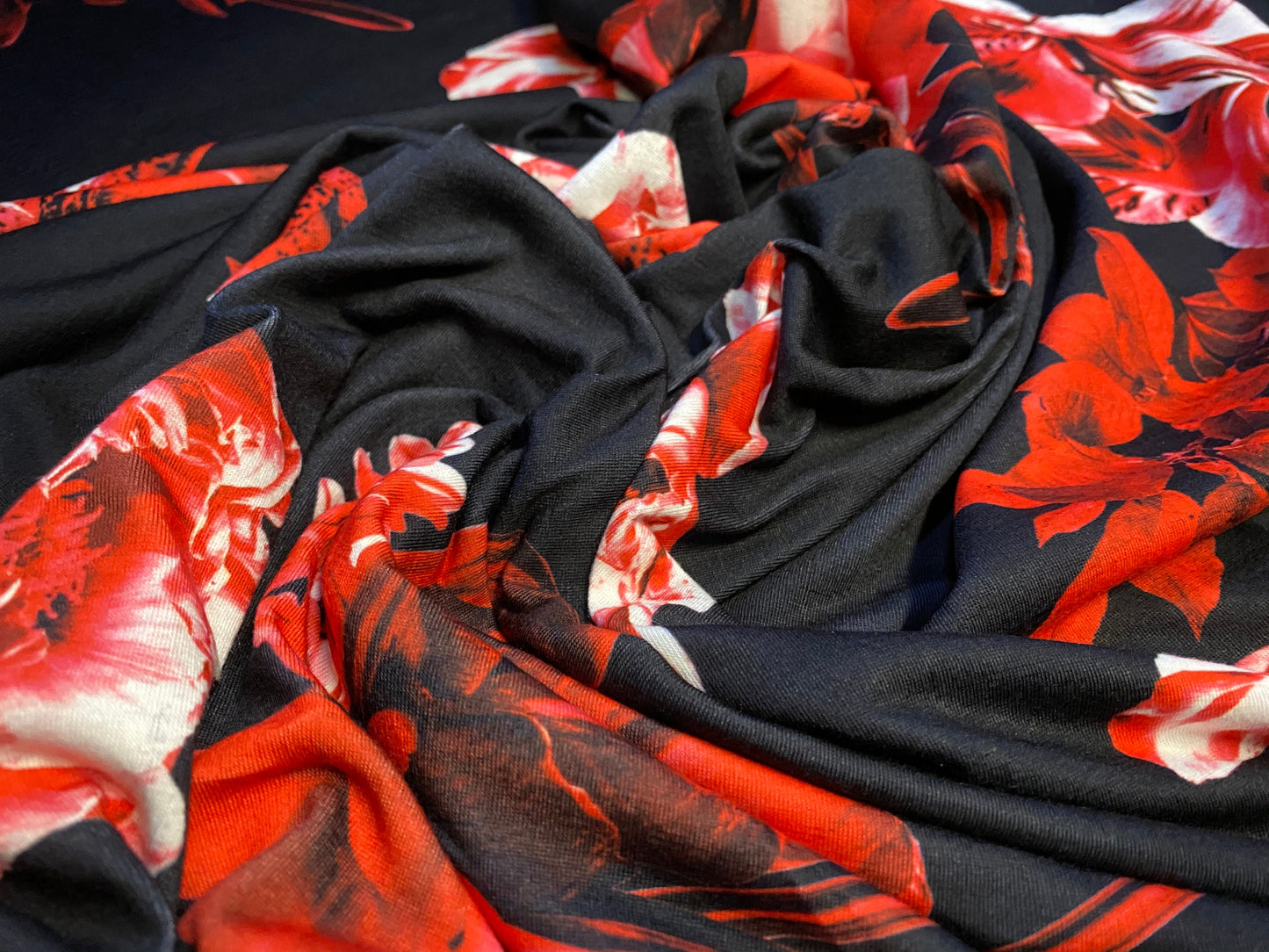 Soft handle jersey fabric, per metre - black with red orchid print